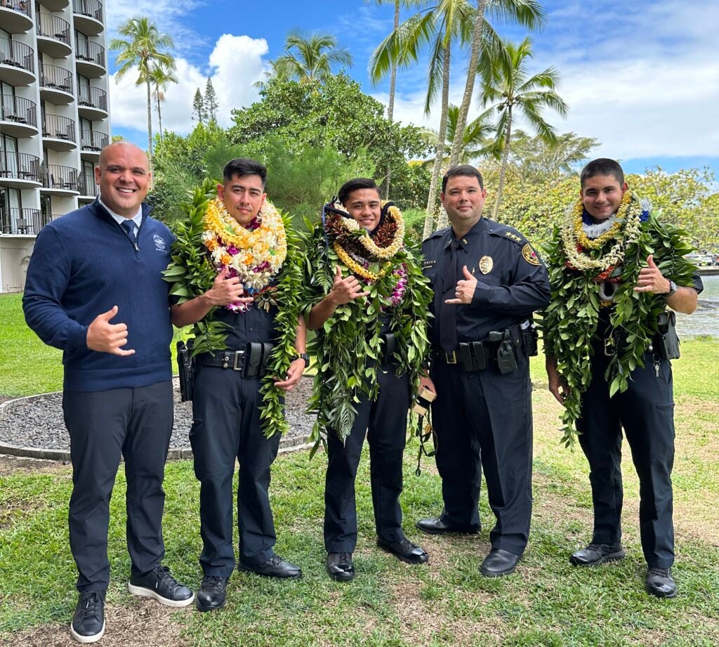 Micah Alameda, executive assistant to Mayor Alameda, Brandon Uyeno-Hatori, Kastle Quiocho, Interim Chief Reed Mahuna, Cody Hirata at the recruit graduation for the 102nd HPD recruit class.