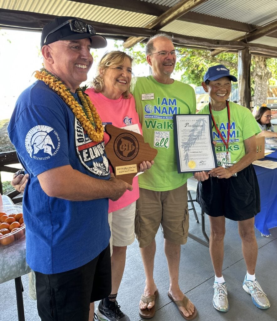 2025 NAMIWalks group photo of four people including Detective Jason Grouns.