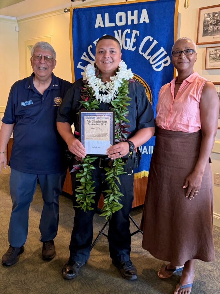 Pictured from left to right is James Sanborn of the Aloha Exchange Club of East Hawaii with the Officer of the Month and Becky Marshall of the Visitor Aloha Society of Hawaiʻi Island (VASH).