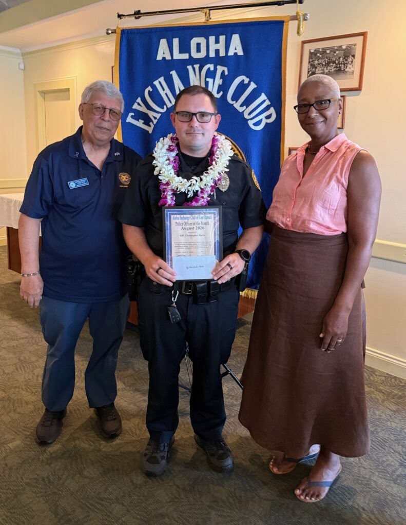 Pictured from left to right is James Sanborn of the Aloha Exchange Club of East Hawaii with the Officer of the Month and Becky Marshall of the Visitor Aloha Society of Hawaiʻi Island (VASH).
