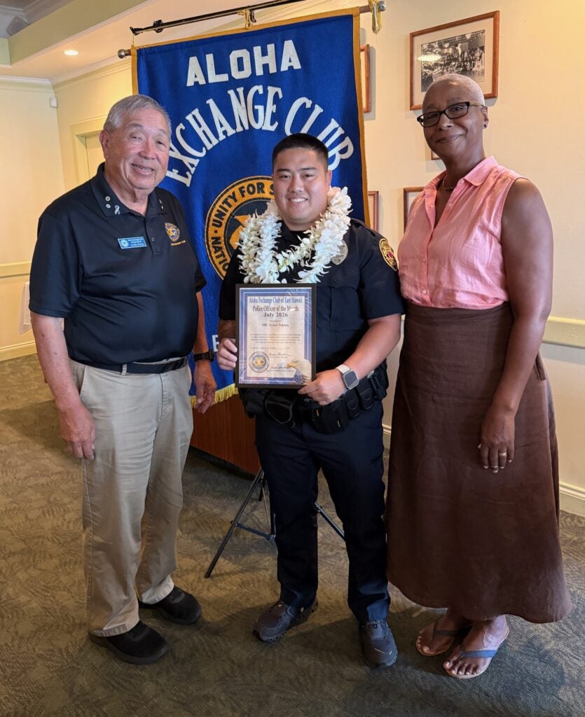 Pictured from left to right is James Sanborn of the Aloha Exchange Club of East Hawaii with the Officer of the Month and Becky Marshall of the Visitor Aloha Society of Hawaiʻi Island (VASH).
