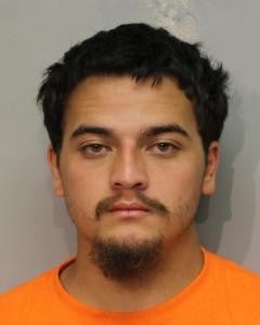 mugshot of 21-year-old Ayzen Enos of Honomu. 