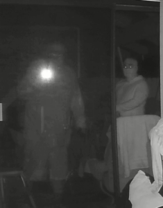 Dark photo of two suspects, one skinny and one heavy set, sought in a Kona burglary investigation.
