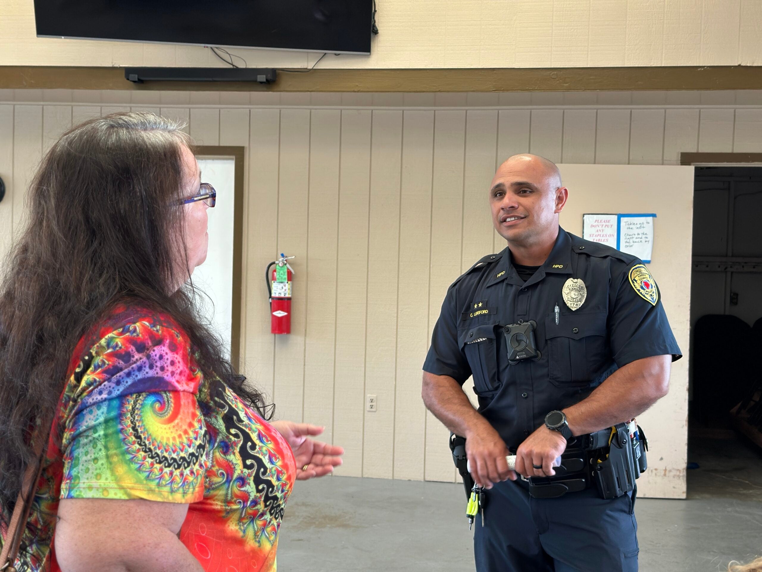 CPO Chance Lunsford talking with woman at Coffee With a Cop event.