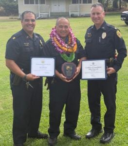 Capt. Pernell Hanoa, Ofcr Winston Gani, Ka'u Officer of the Quarter for Q4 2025 holding award, Acting Assistant Chief Thomas Shopay. 