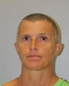59-year-old Elizabeth Stearn. Stearns is Caucasian, 5 feet and 7 inches tall, 148 pounds, with a shaved head. 