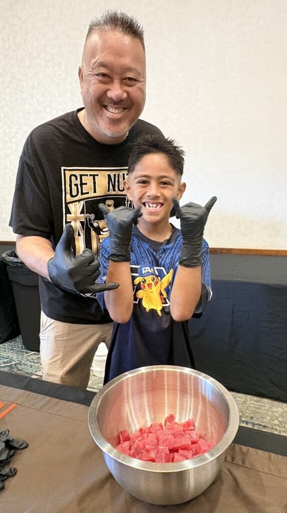 Father and son at poke contest
