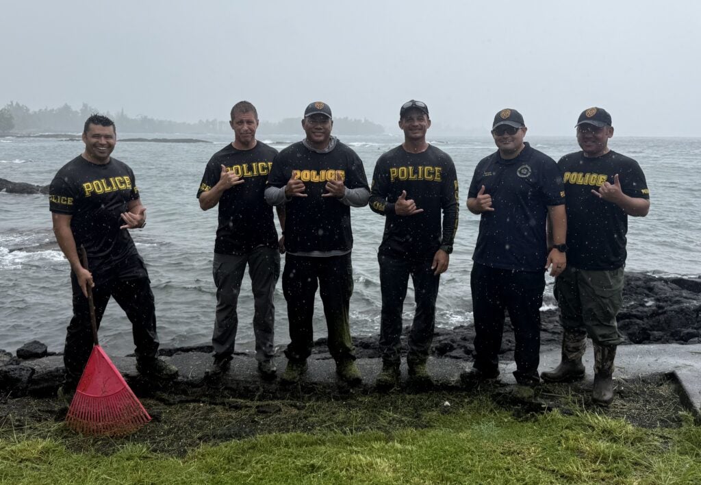 Hilo Community Policing officers group photo at beach clean-up.
