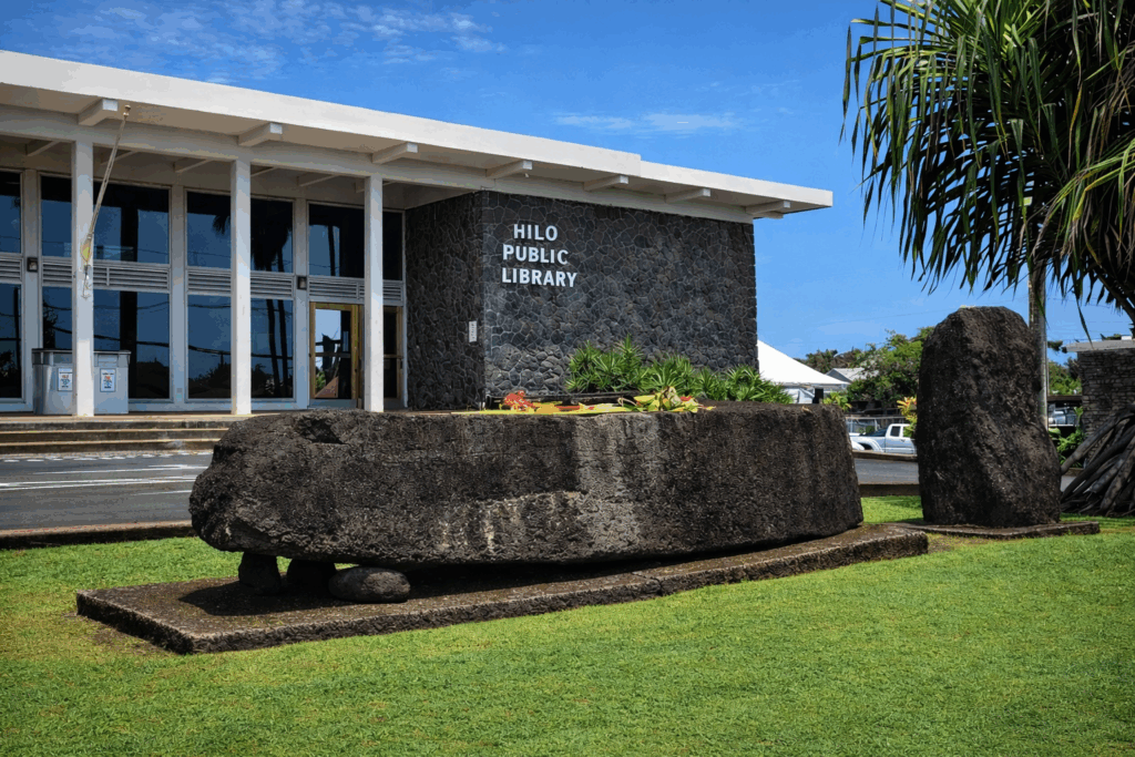 Front of Hilo Public Library with rock in foreground.