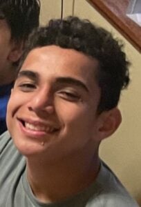 Picture of 14-year-old Kawelo Lancaster, who is described as having a tan complexion and thin build, about 5 feet 7 inches tall, 145 pounds, with short, curly black hair and brown eyes.