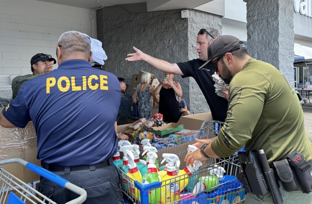 Kona Walmart Fill a Cruiser - Sgt. Nahale and Ofcr. Young with DLNR officers.