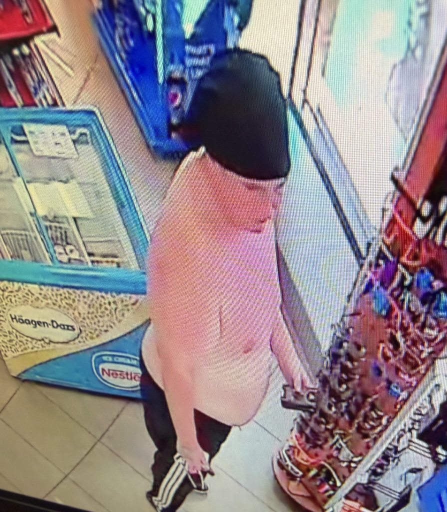 Kona theft suspect side-view: a Caucasian man in his 20s, shirtless, and wearing black pants.