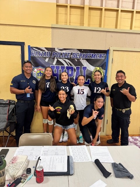 Police Officers Abalos and Chaves with volleyball players.