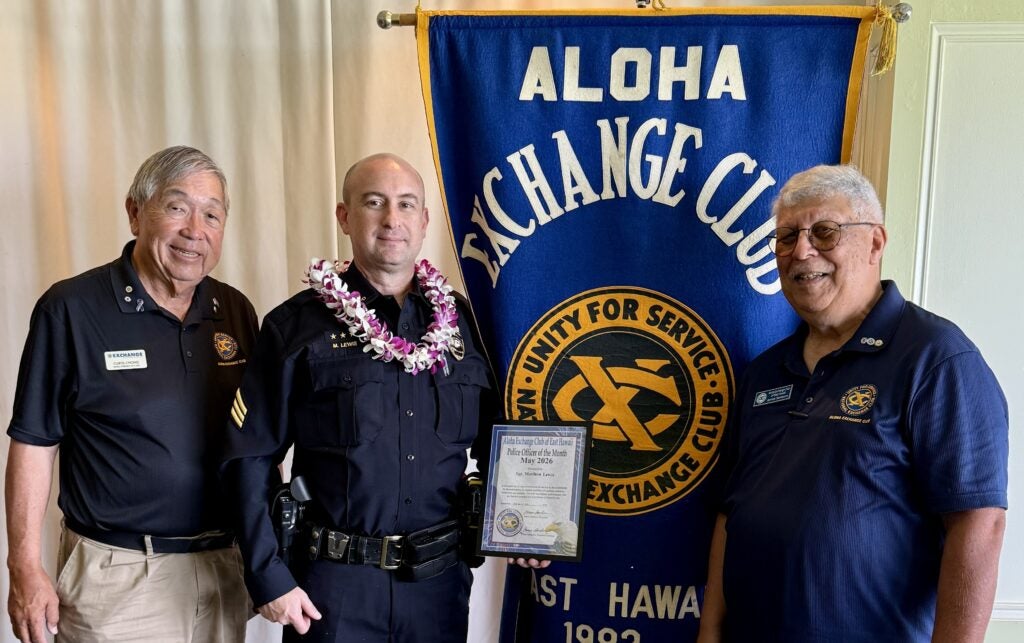 Members of Aloha Exchange Club and Sergeant Matthew Lewis.