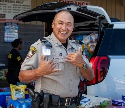Sheriff with shaka at Kona Costco food drive