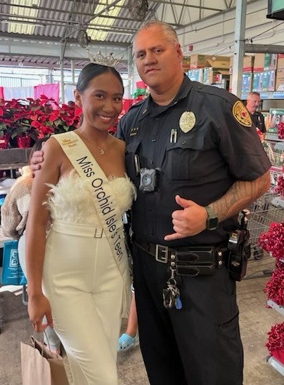 Officer Warren and Miss Orchid Isle Teen during Shop With a Cop.