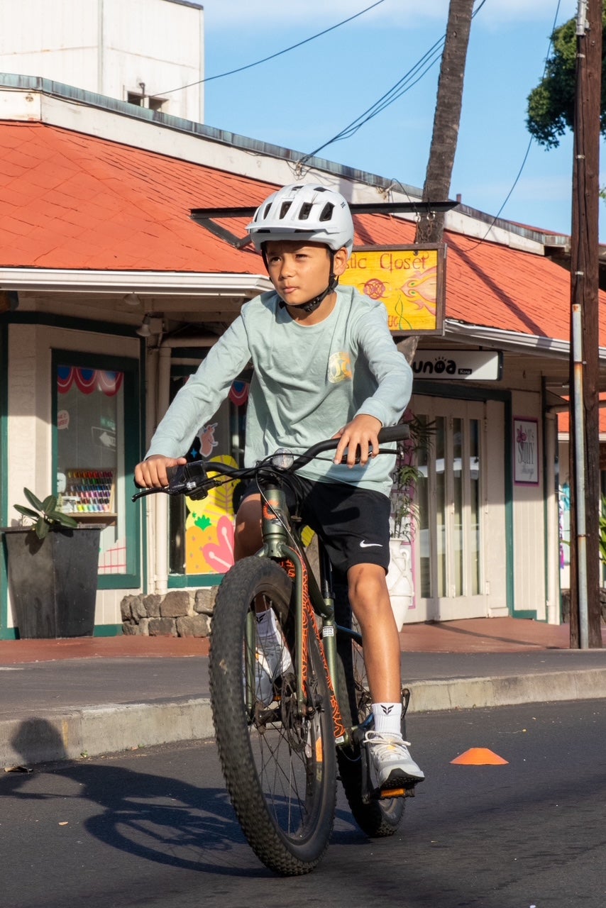 Young boy riding bike during HPD bike day event