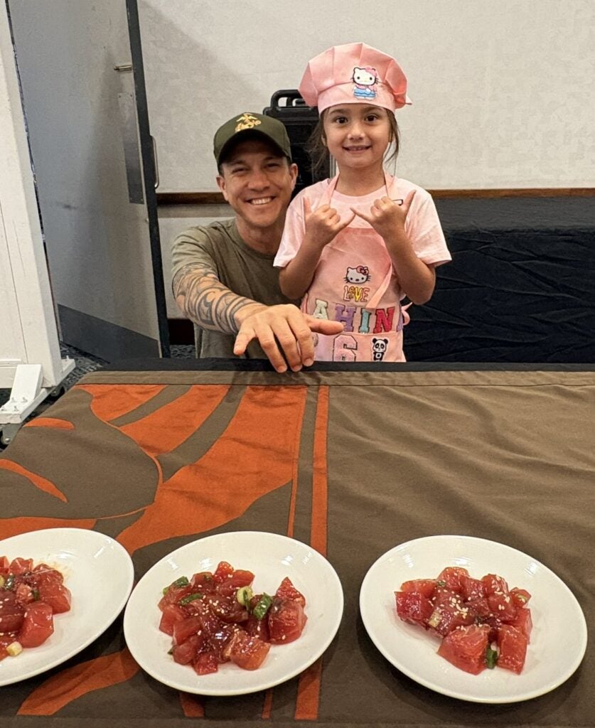 Young girl chef and dad at Poke contest
