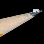 image of a couple grains of salt on the tip of a pencil to illustrate a lethal dose of illicit fentanyl.